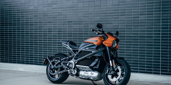 Electric motorcycle against a tiled wall